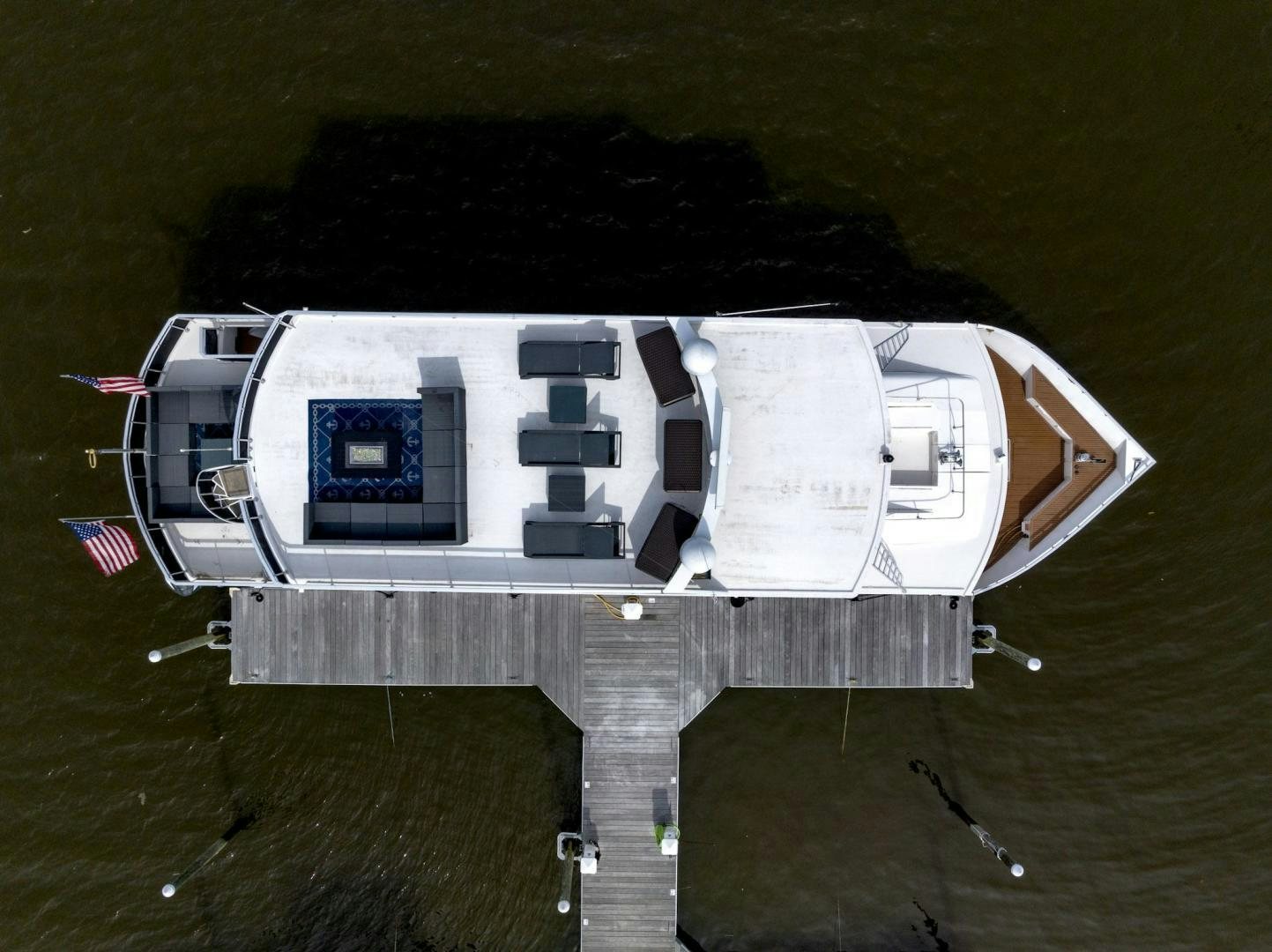 a building with a flag on the roof aboard KNOT TIDE DOWN Yacht for Sale
