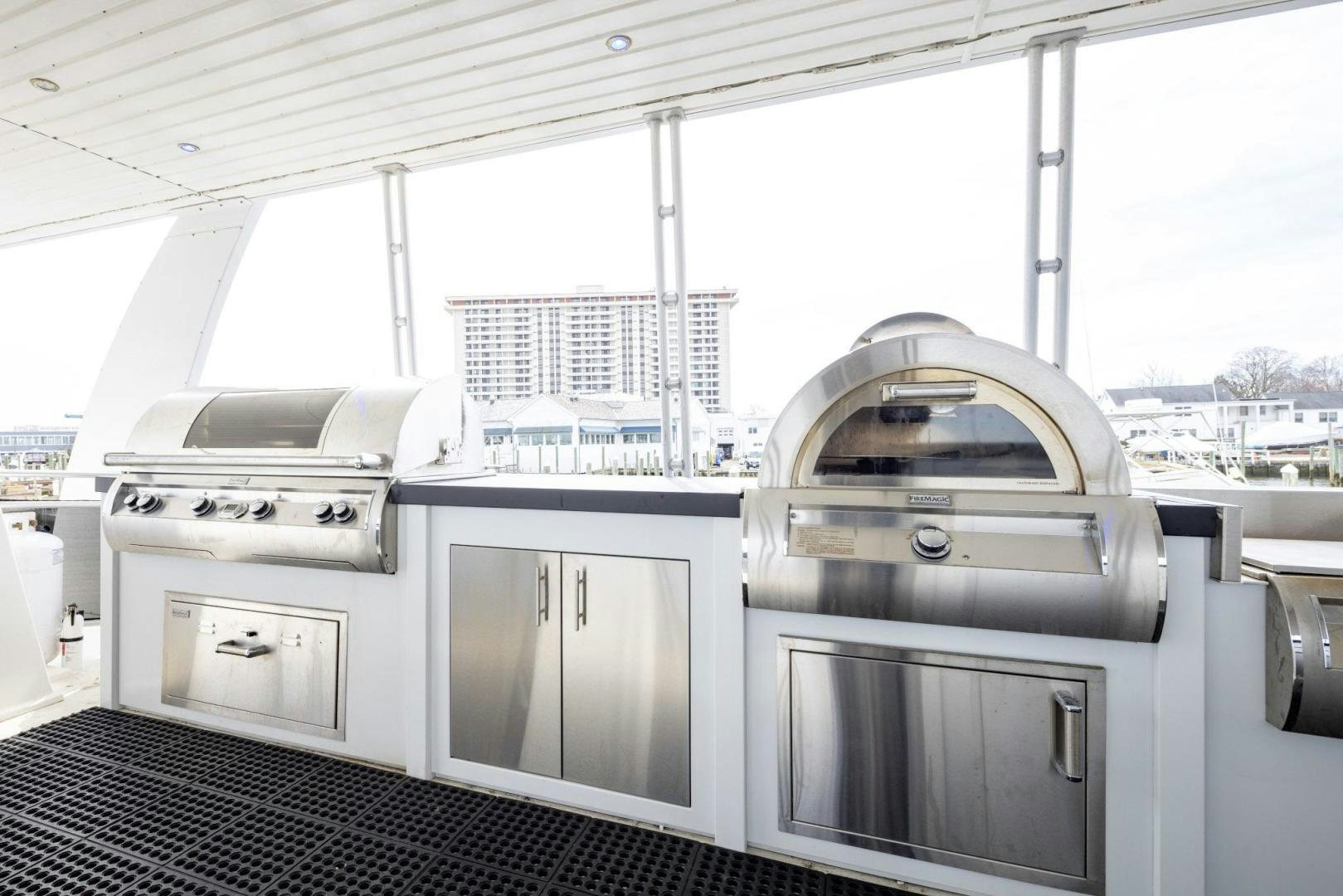 a large kitchen with white cabinets aboard KNOT TIDE DOWN Yacht for Sale