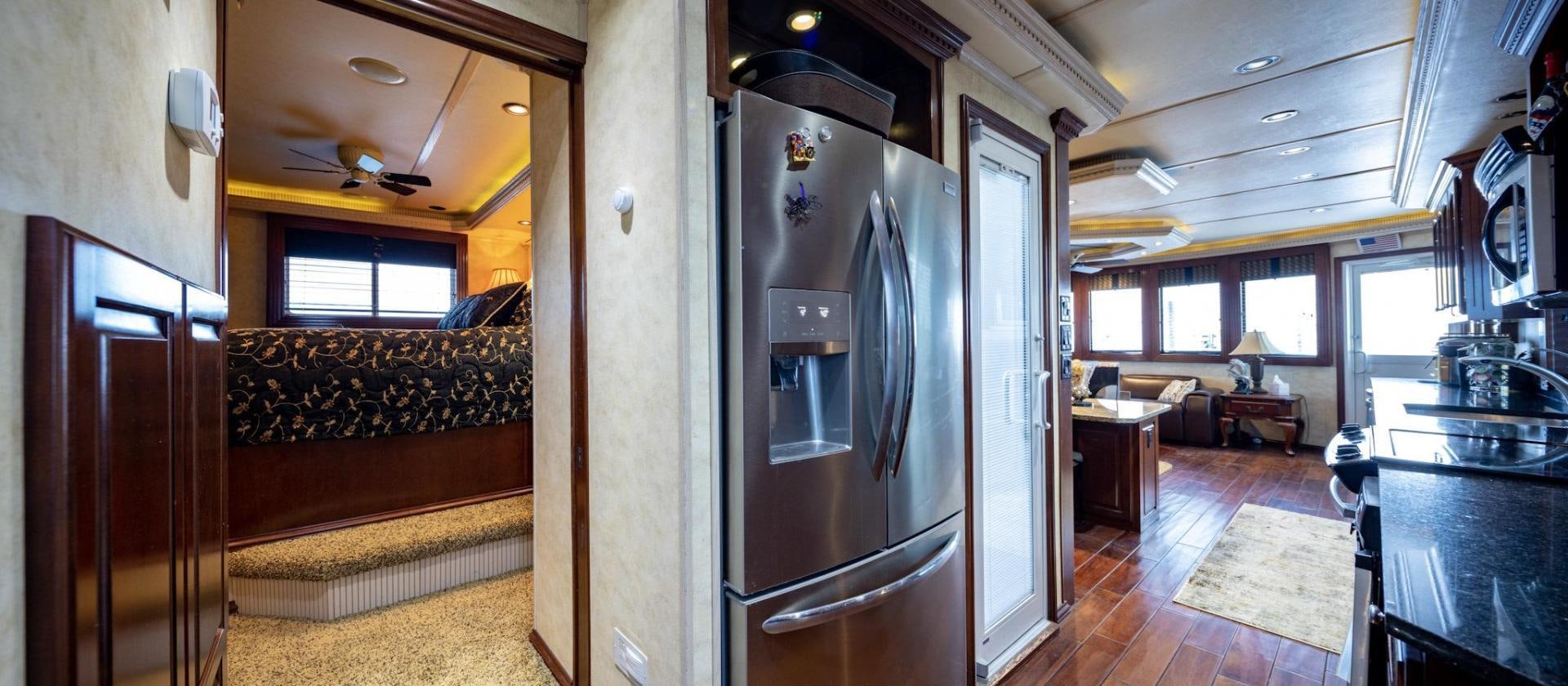 a kitchen with a fridge aboard KNOT TIDE DOWN Yacht for Sale