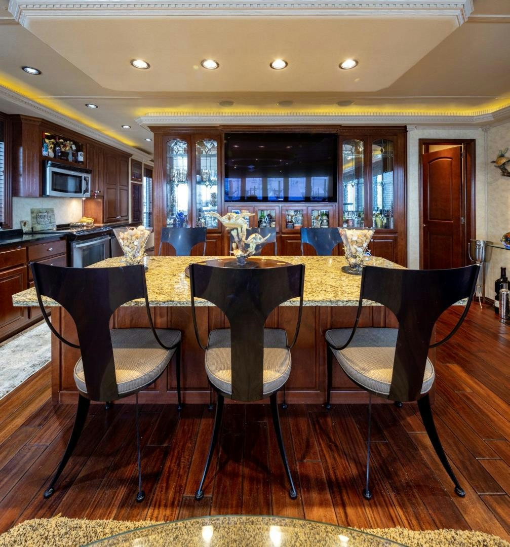 a bar with a table and chairs aboard KNOT TIDE DOWN Yacht for Sale