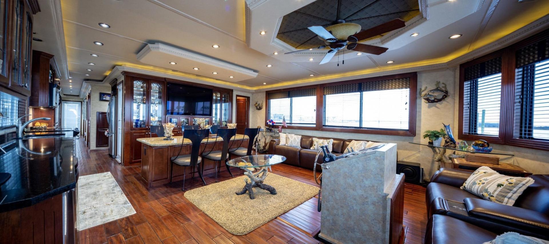 a living room with a couch and a table aboard KNOT TIDE DOWN Yacht for Sale