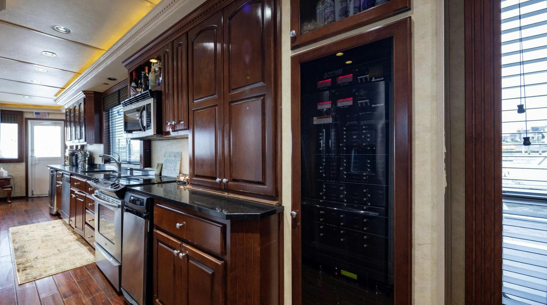a kitchen with wooden cabinets aboard KNOT TIDE DOWN Yacht for Sale