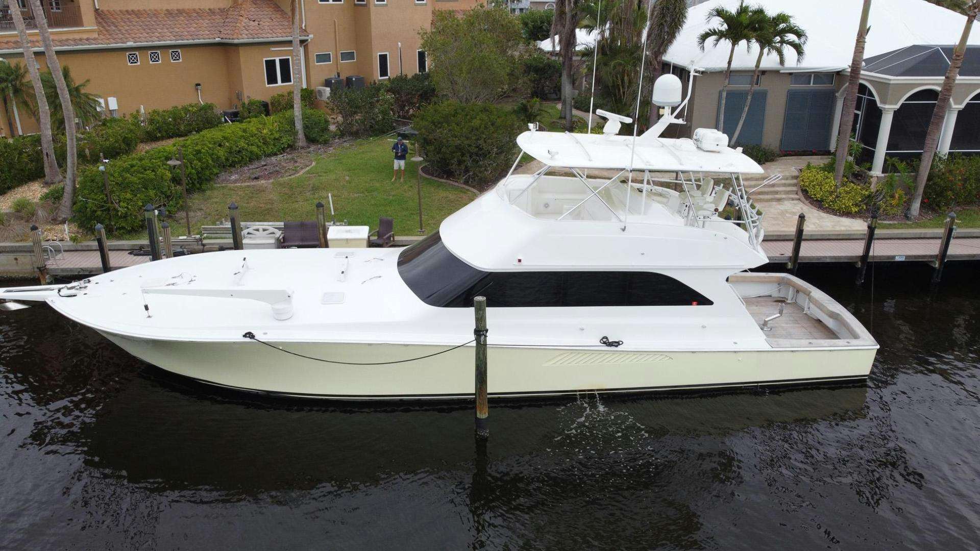 a white boat in a body of water aboard SHILOH Yacht for Sale