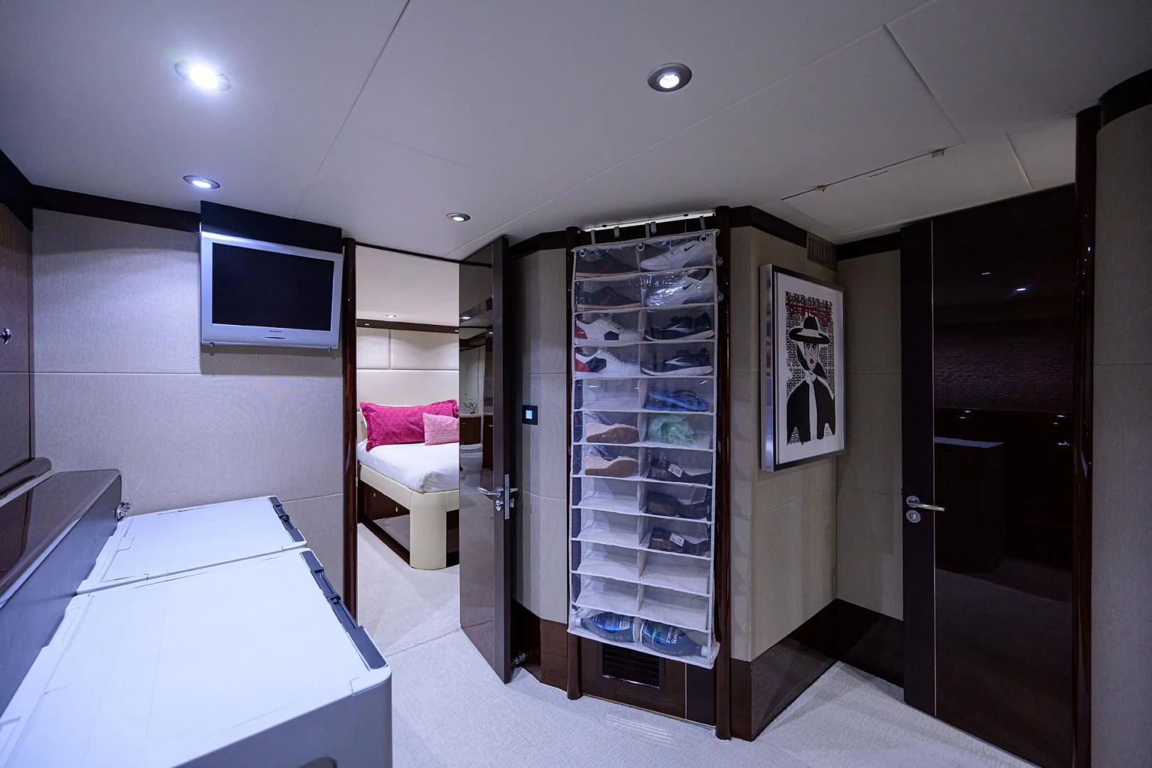 a room with a bed and a tv aboard PURE ROMANCE Yacht for Sale