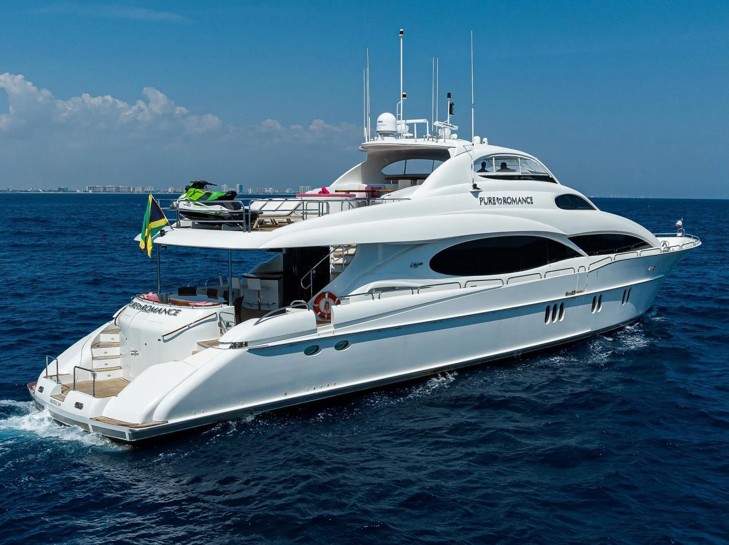 a white yacht in the water aboard PURE ROMANCE Yacht for Sale
