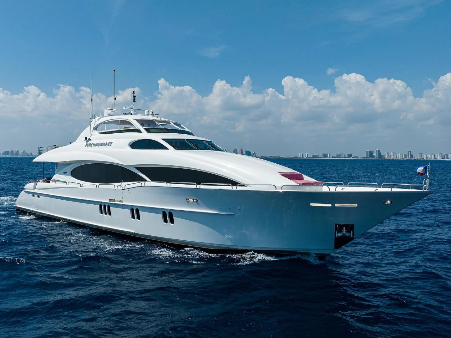 a white yacht in the water aboard PURE ROMANCE Yacht for Sale