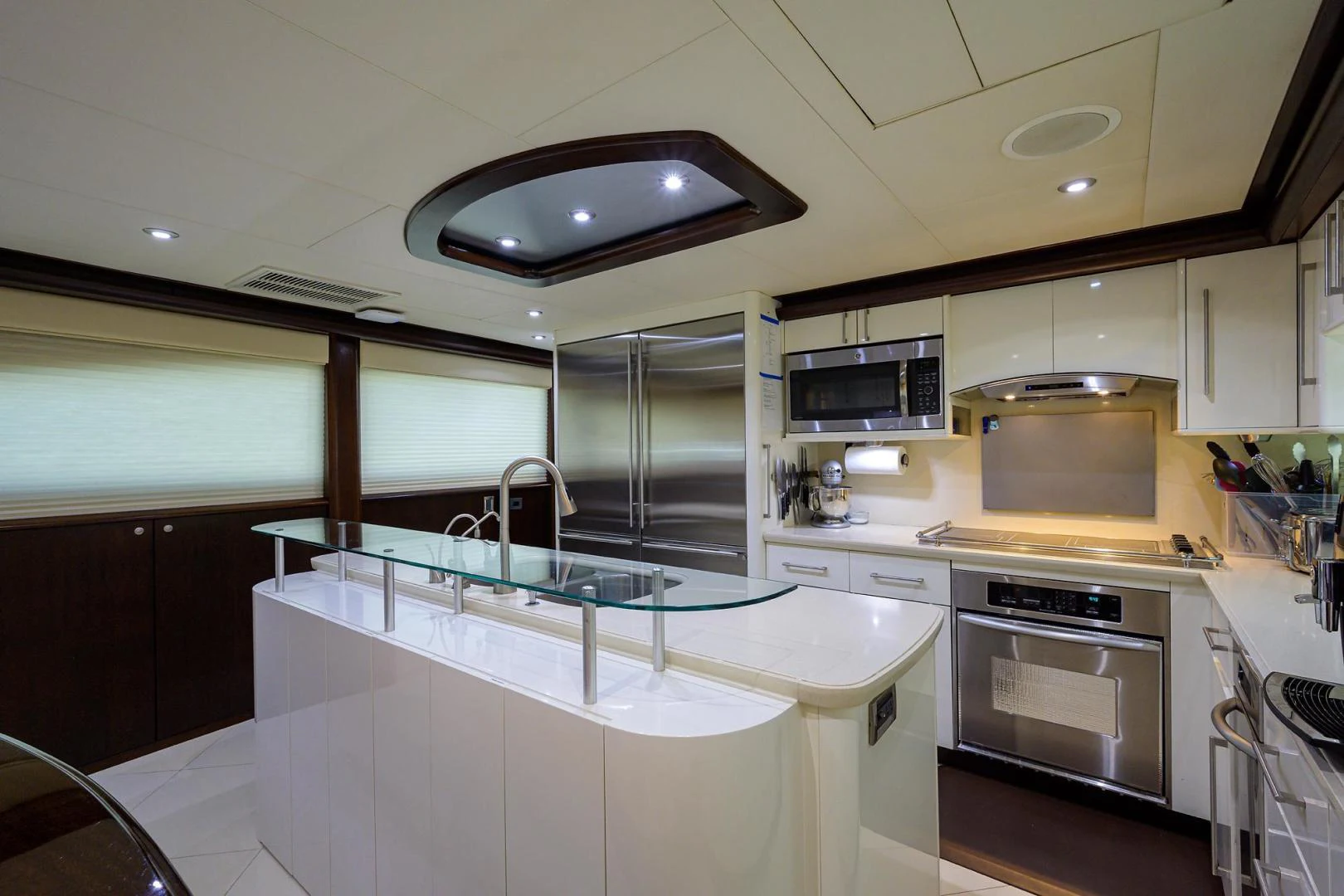 a kitchen with a large island aboard PURE ROMANCE Yacht for Sale
