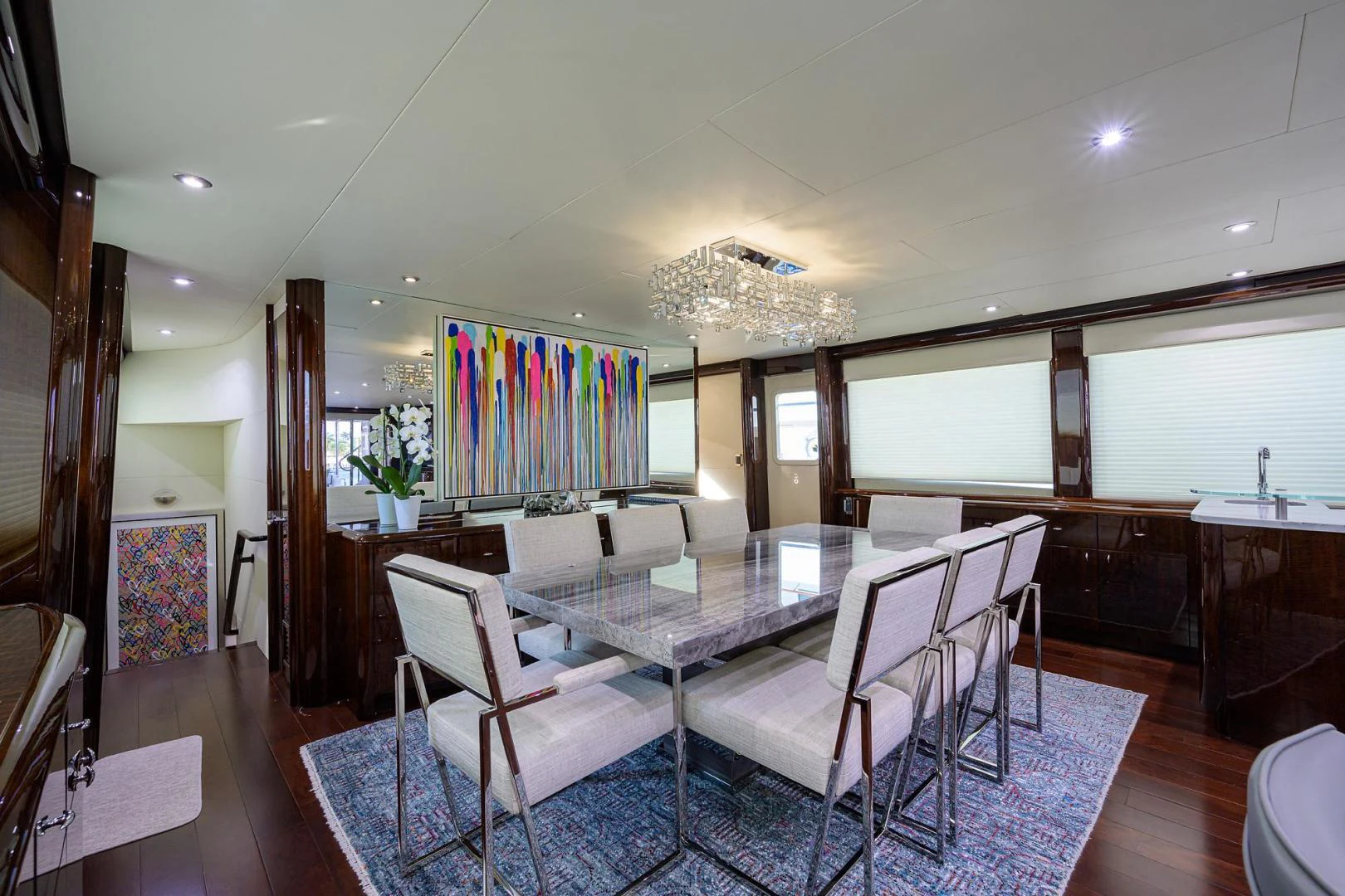 a dining room with a table and chairs aboard PURE ROMANCE Yacht for Sale