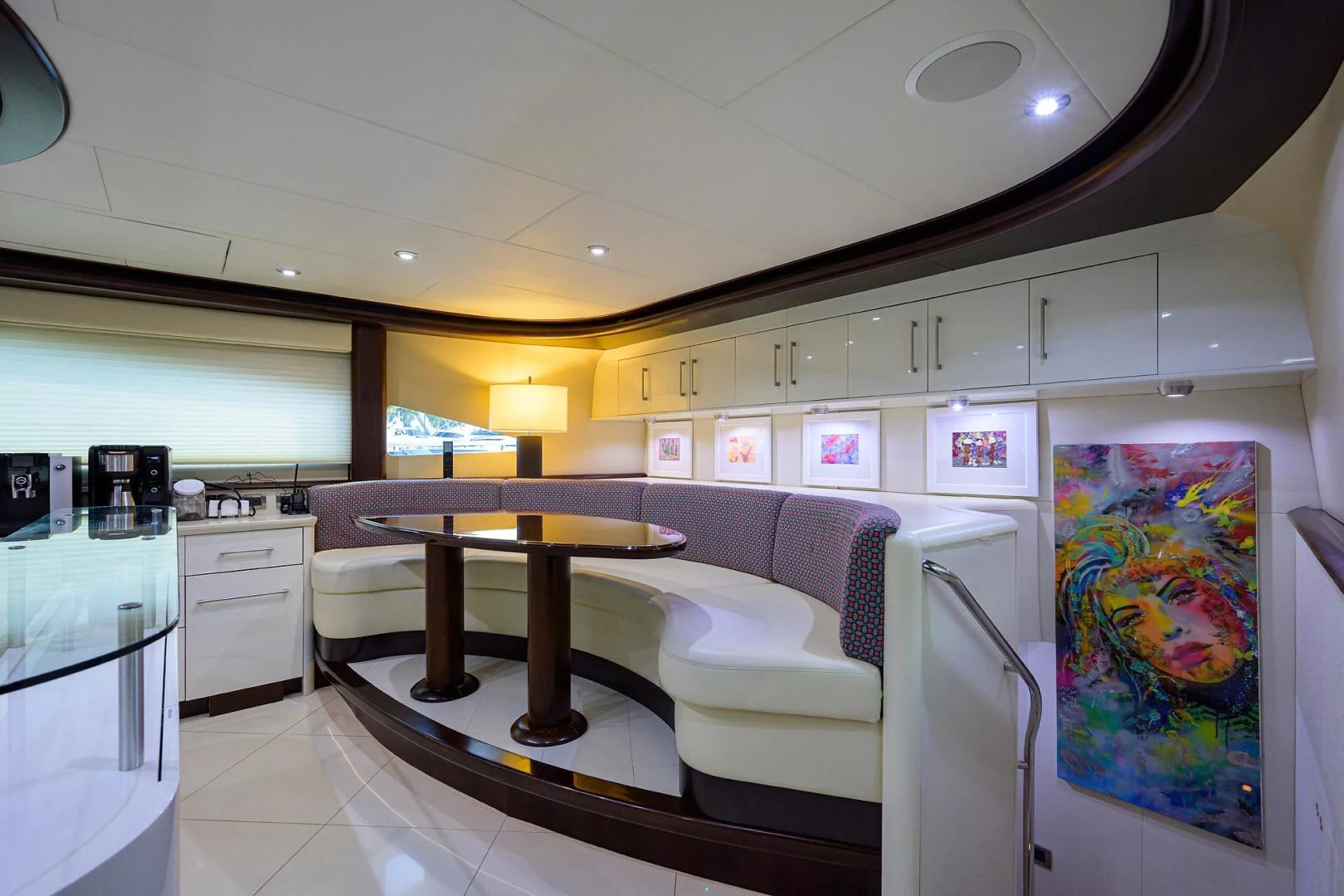 a kitchen with a table and chairs aboard PURE ROMANCE Yacht for Sale