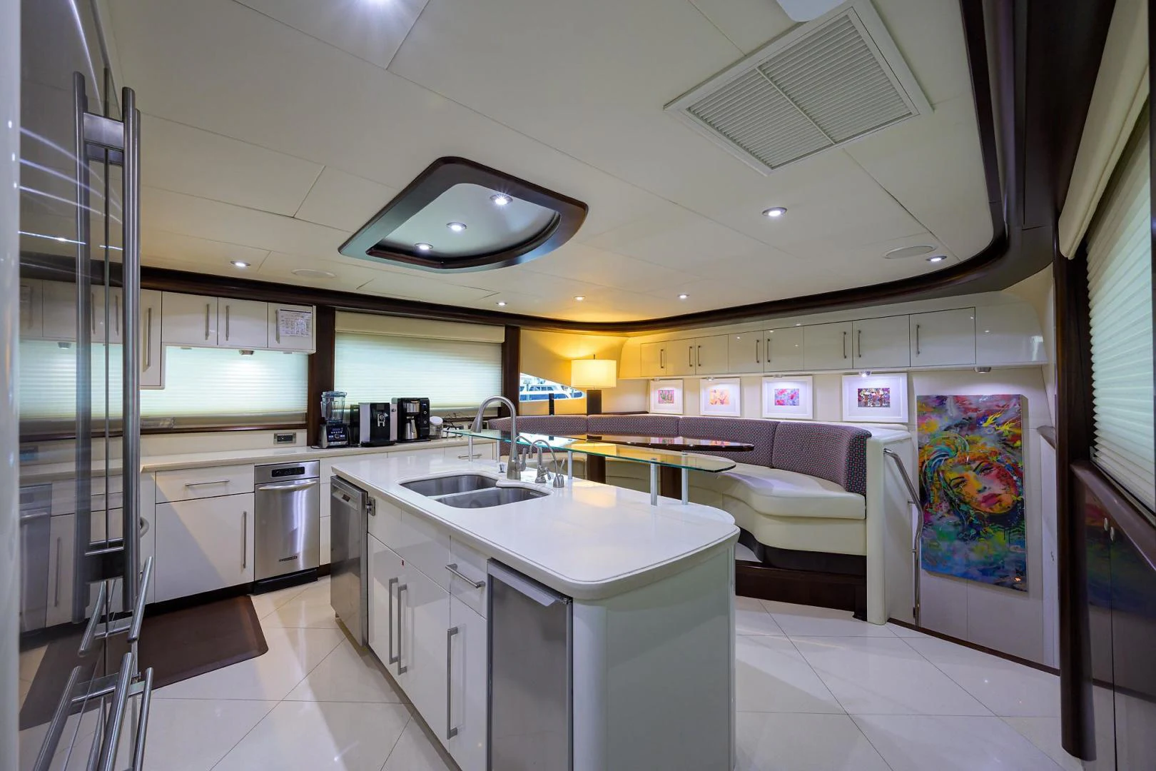 a kitchen with a sink and a couch aboard PURE ROMANCE Yacht for Sale
