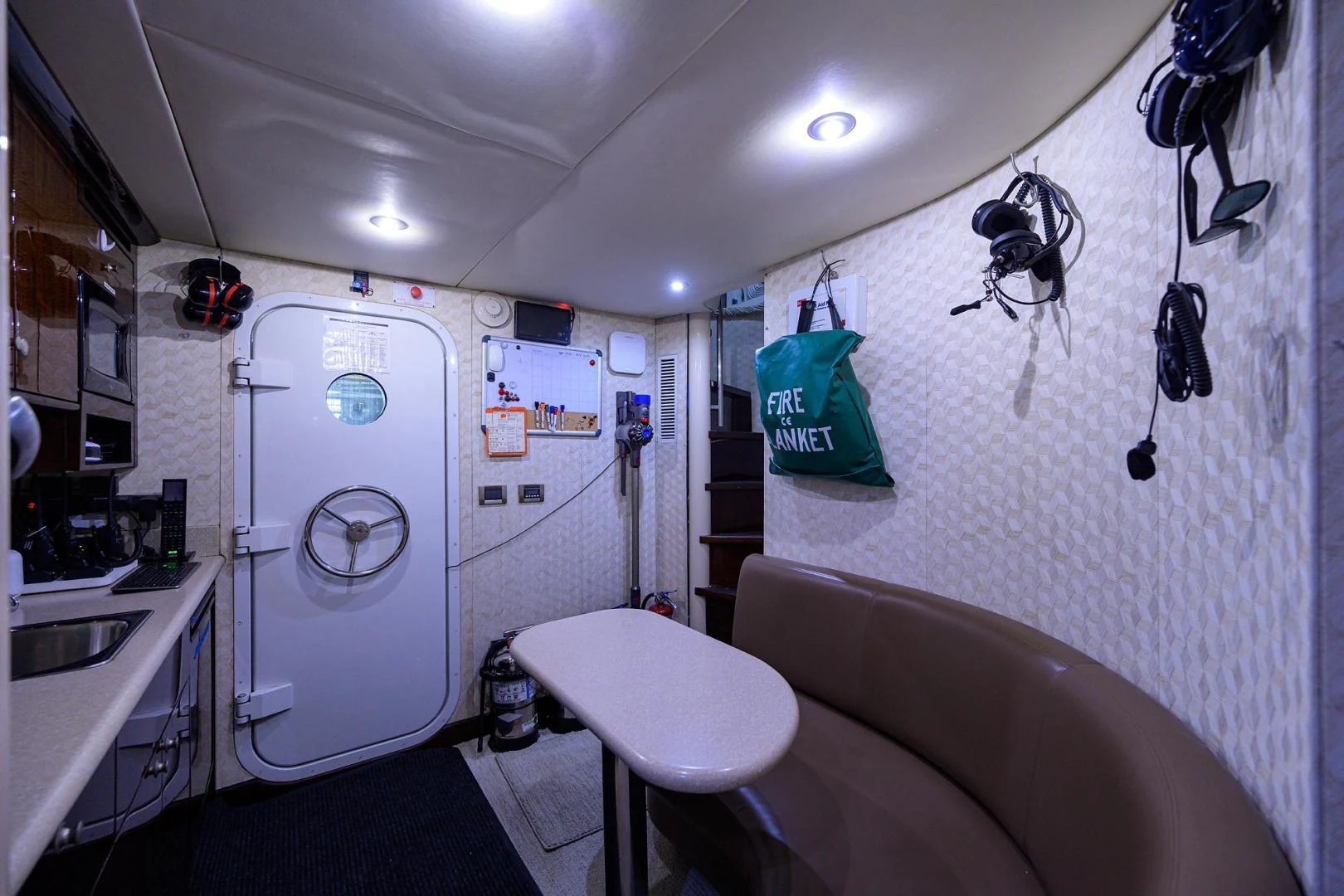 a bathroom with a washing machine aboard PURE ROMANCE Yacht for Sale