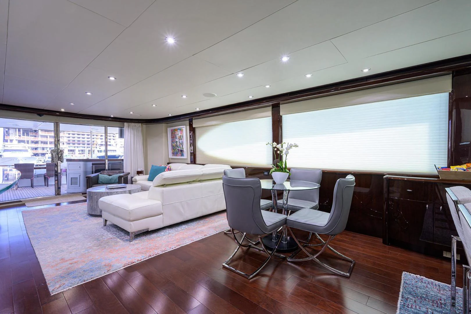 a living room with a large window aboard PURE ROMANCE Yacht for Sale