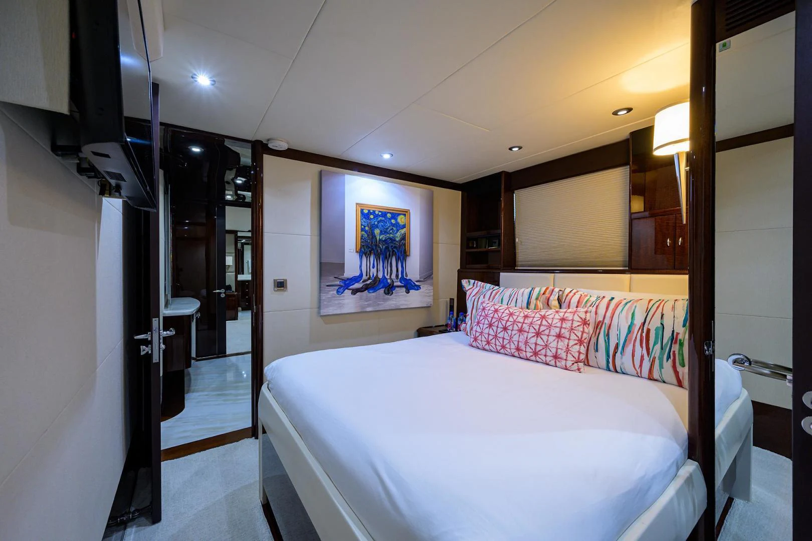 a bedroom with a bed aboard PURE ROMANCE Yacht for Sale