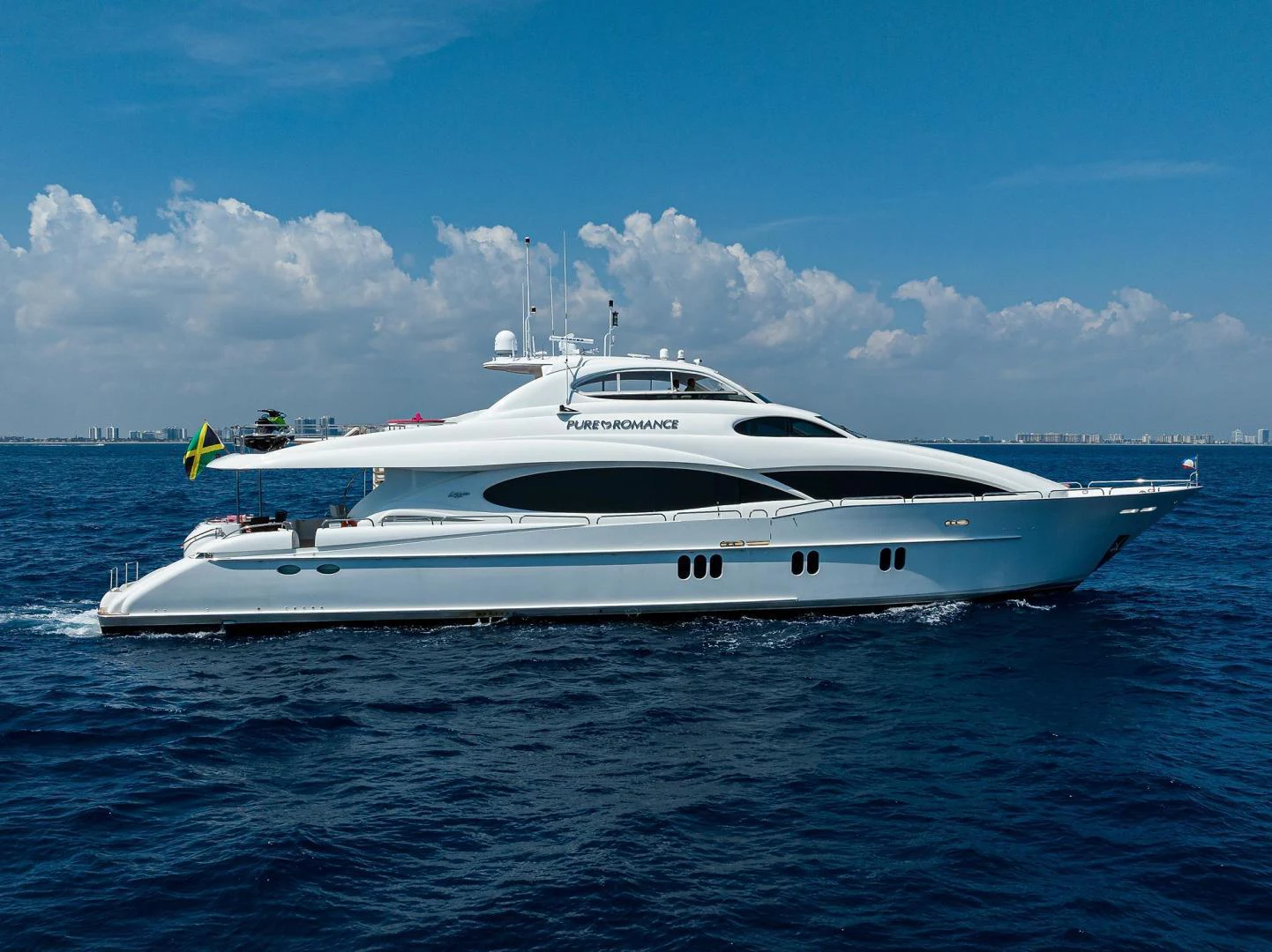 a white yacht in the water aboard PURE ROMANCE Yacht for Sale