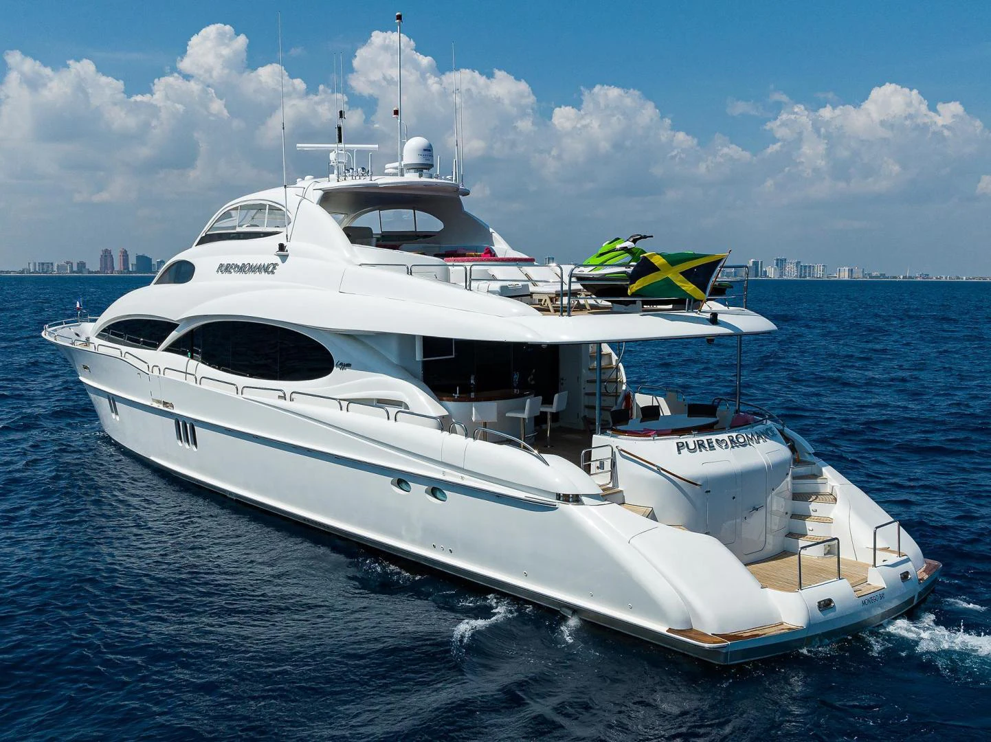 a white yacht in the water aboard PURE ROMANCE Yacht for Sale