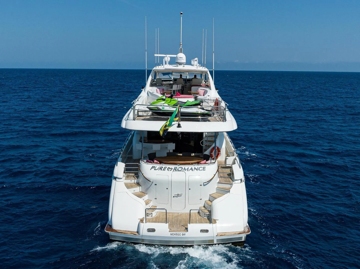 a white boat in the water aboard PURE ROMANCE Yacht for Sale
