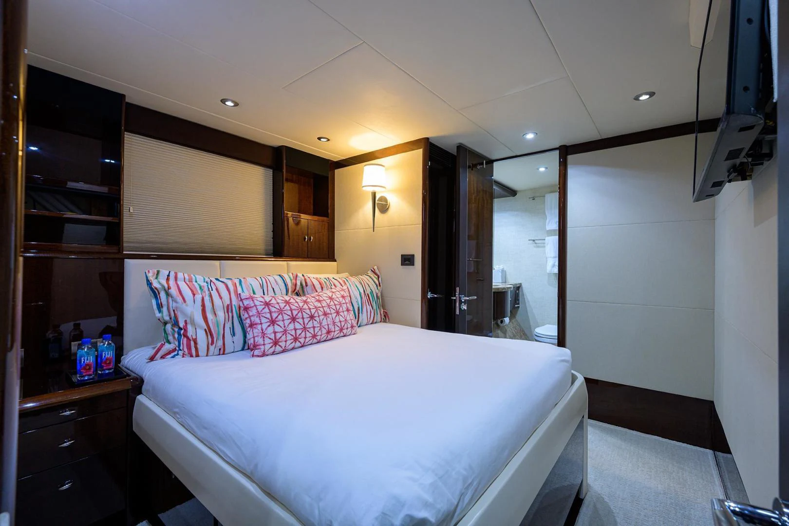 a bed in a room aboard PURE ROMANCE Yacht for Sale