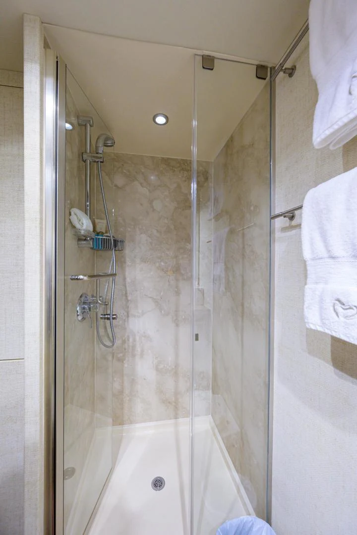 a bathroom with a shower aboard PURE ROMANCE Yacht for Sale