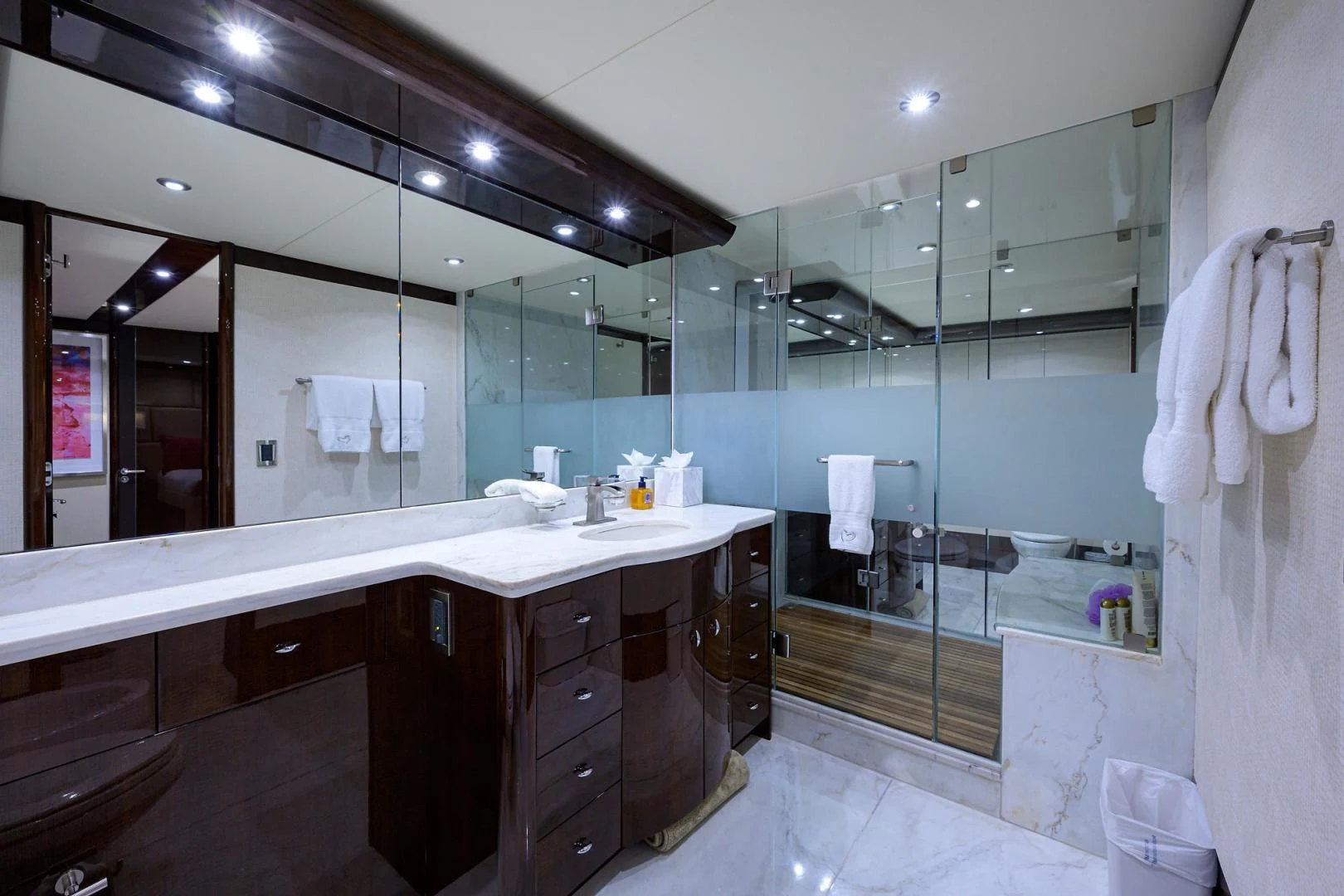 a bathroom with a large mirror aboard PURE ROMANCE Yacht for Sale