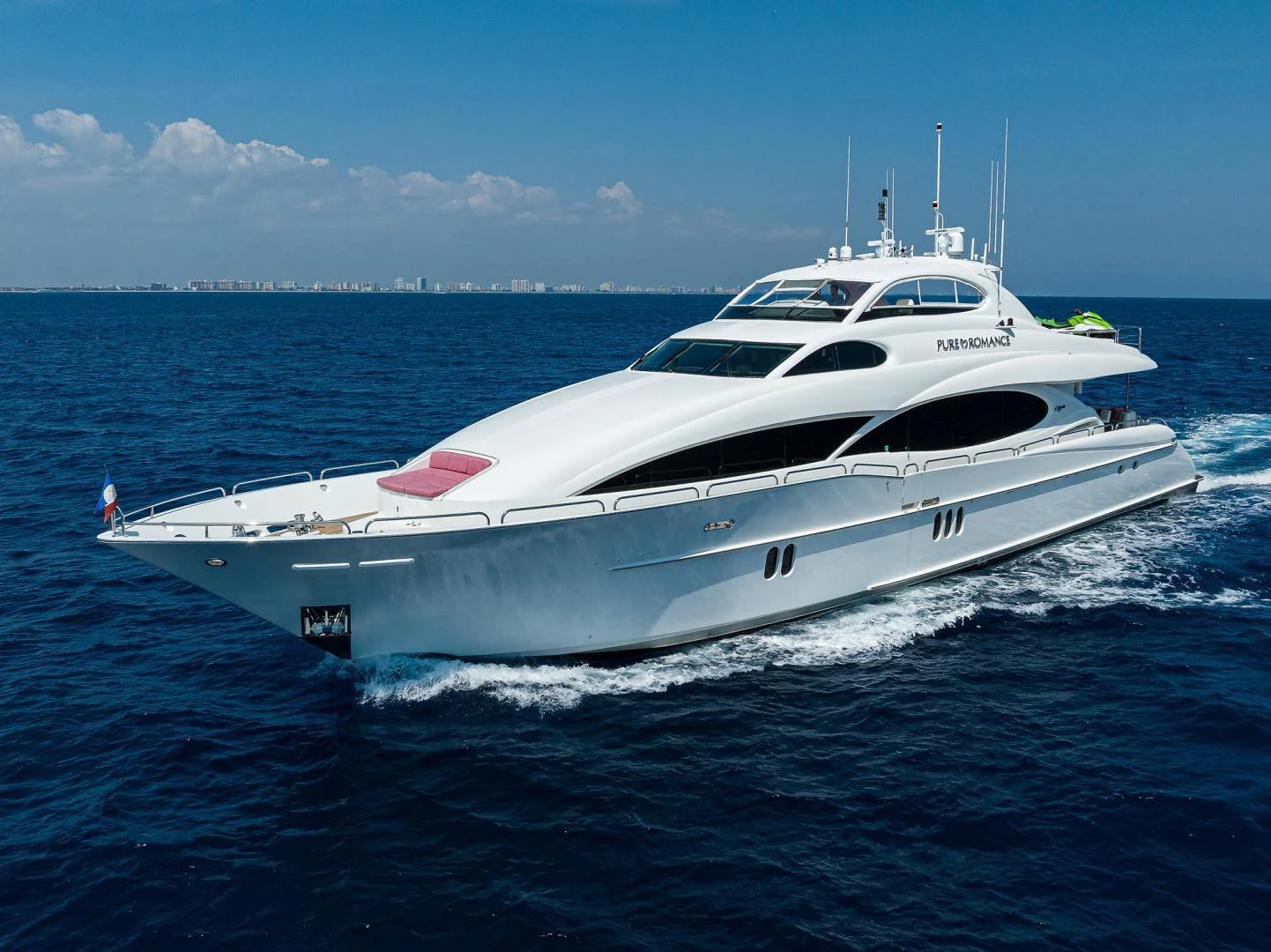 a white yacht on the water aboard PURE ROMANCE Yacht for Sale
