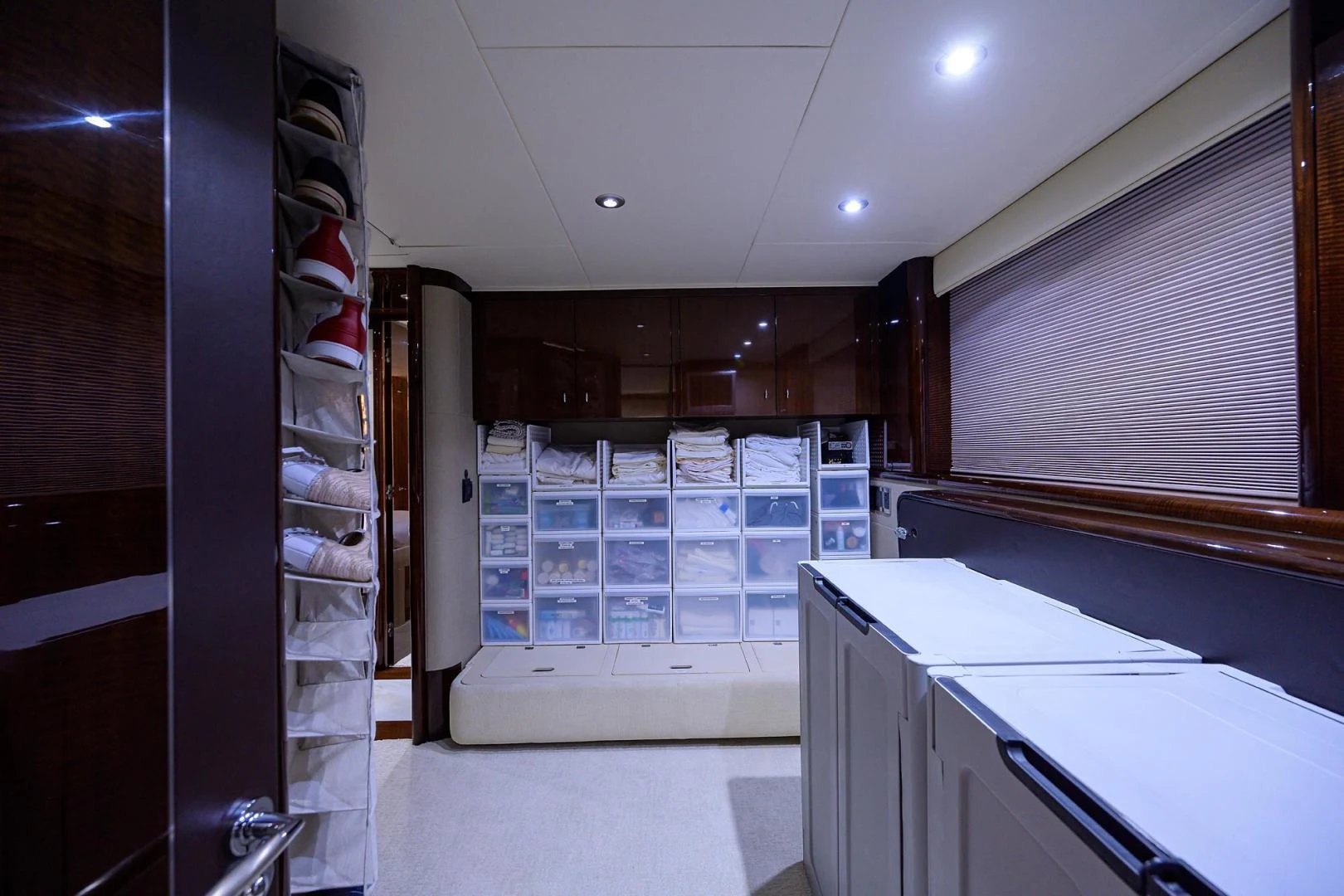 a kitchen with a glass wall aboard PURE ROMANCE Yacht for Sale