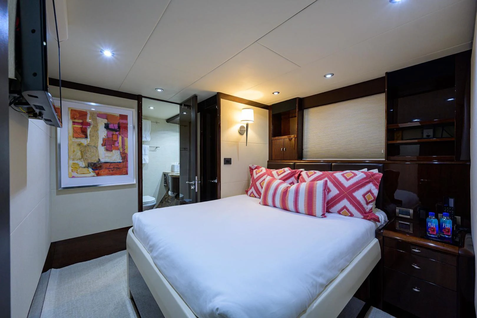 a hotel room with a bed aboard PURE ROMANCE Yacht for Sale