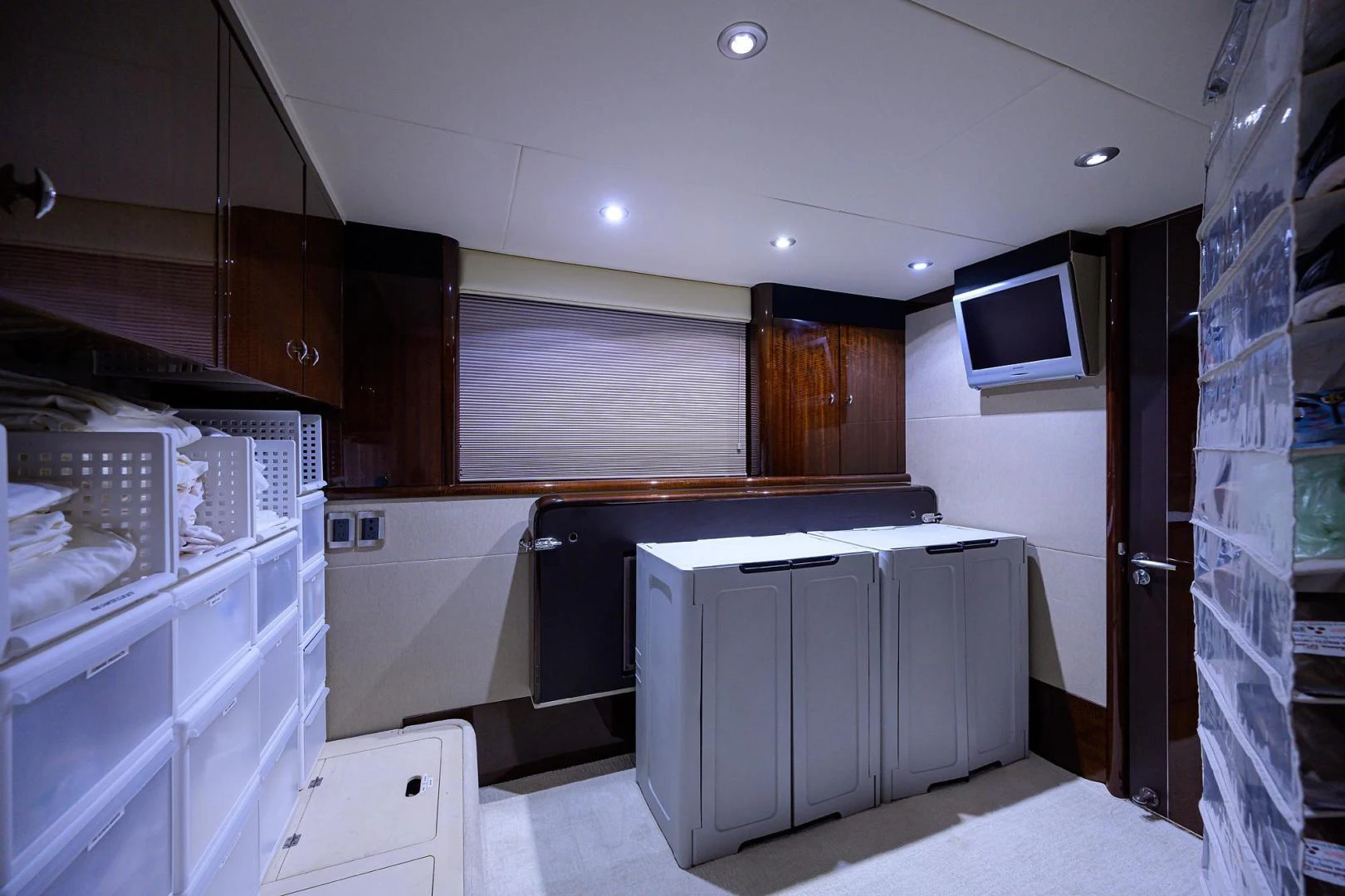 a kitchen with white cabinets aboard PURE ROMANCE Yacht for Sale