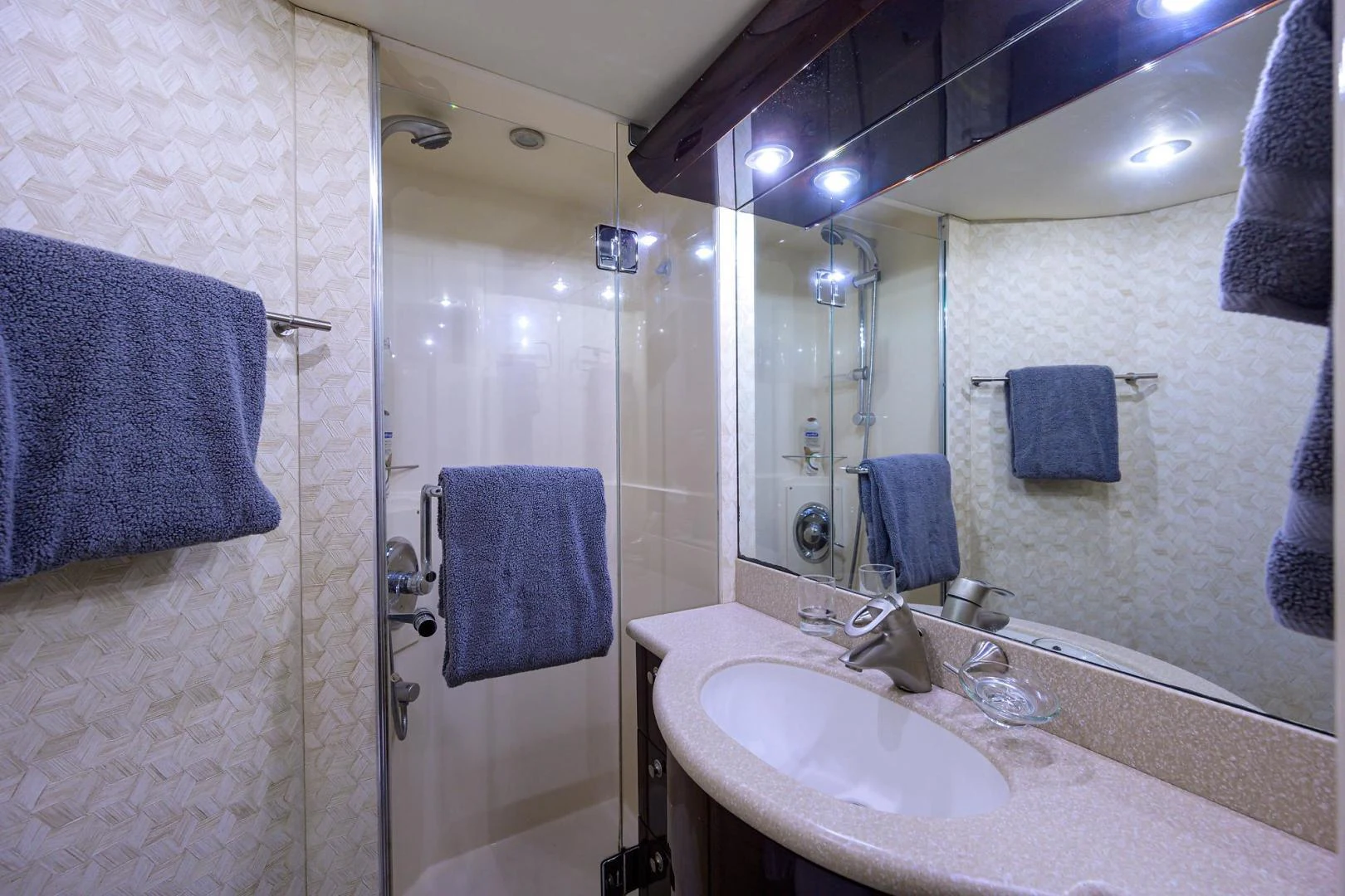 a bathroom with a sink and a shower aboard PURE ROMANCE Yacht for Sale