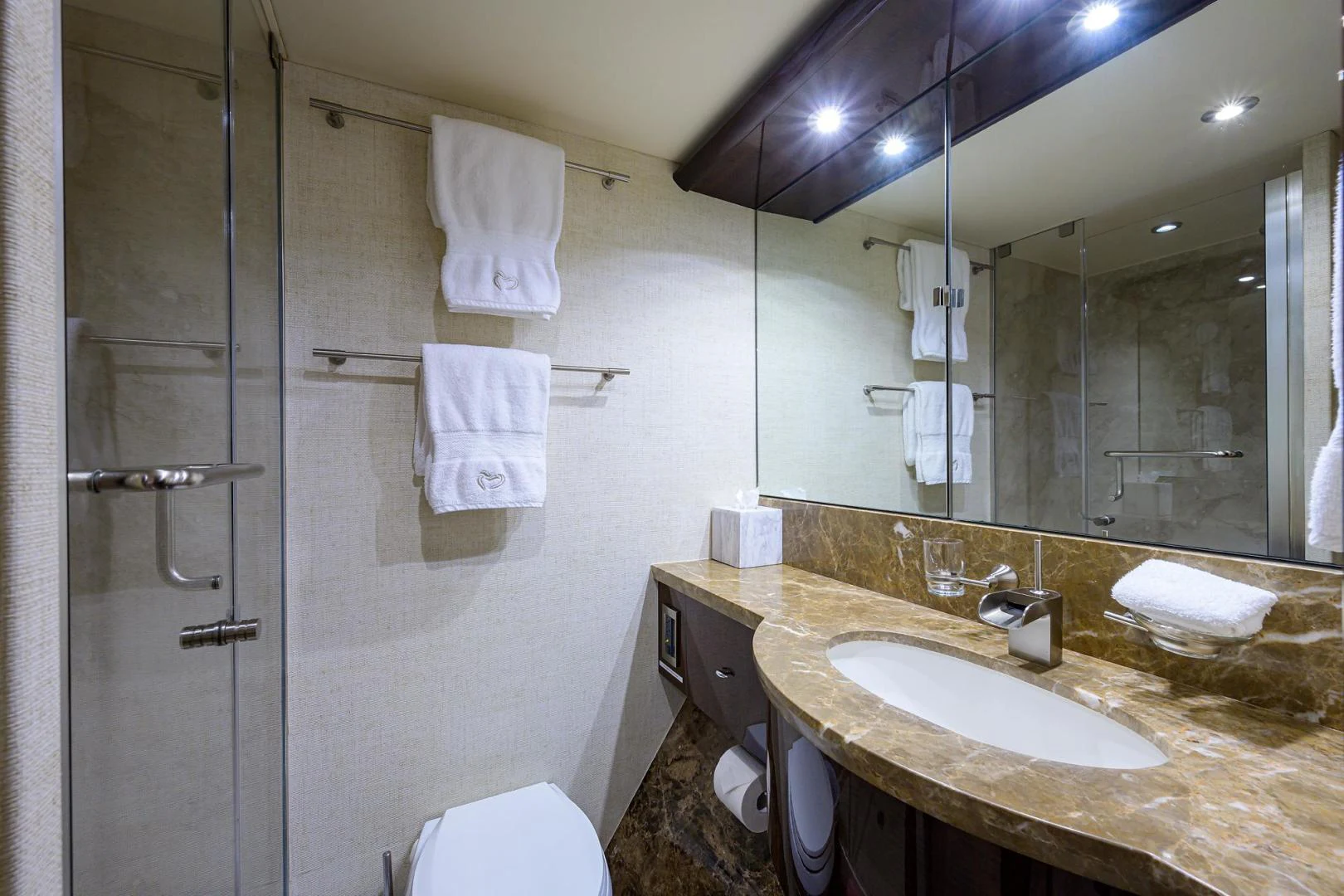 a bathroom with a sink and a mirror aboard PURE ROMANCE Yacht for Sale