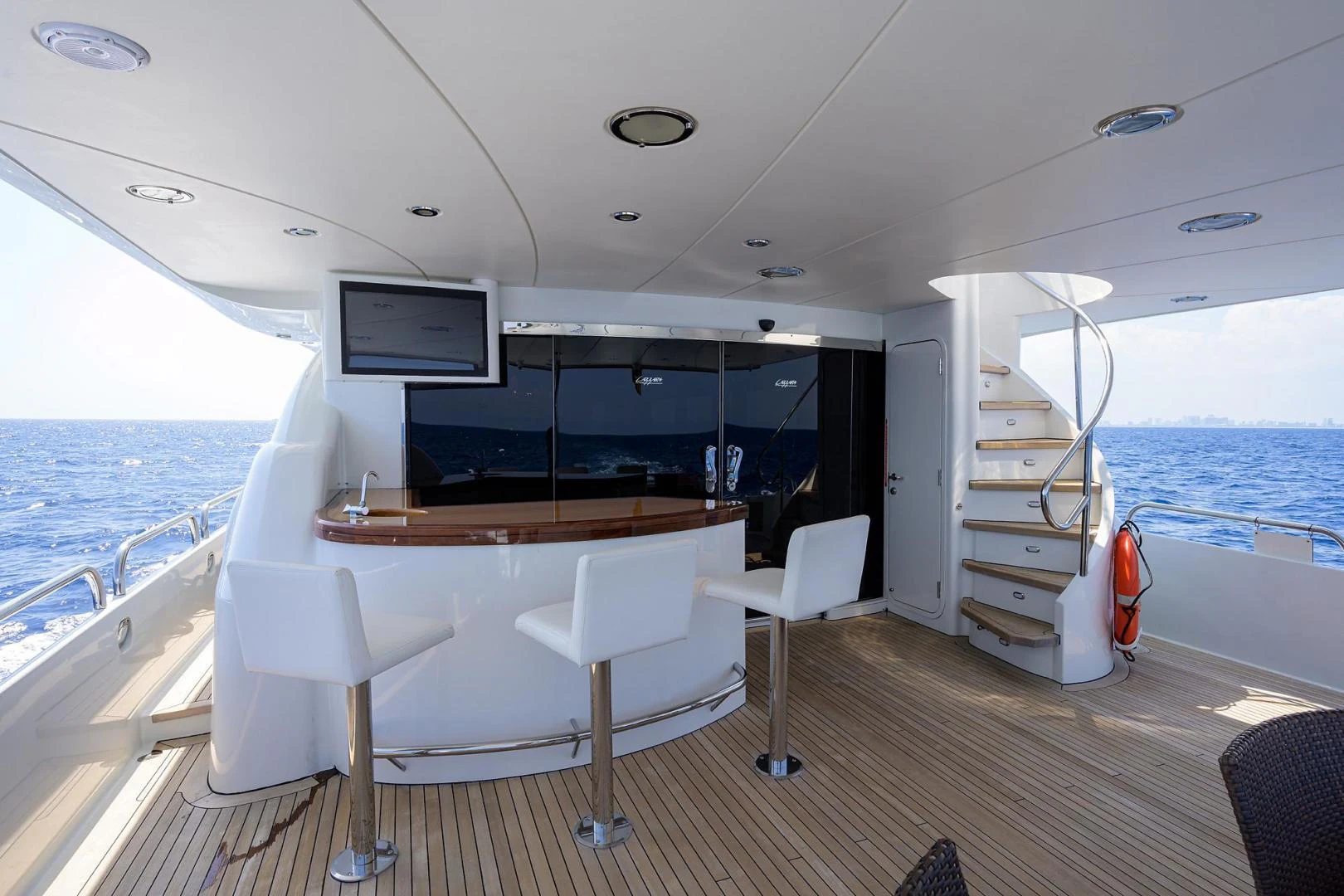 a room with a table and chairs aboard PURE ROMANCE Yacht for Sale