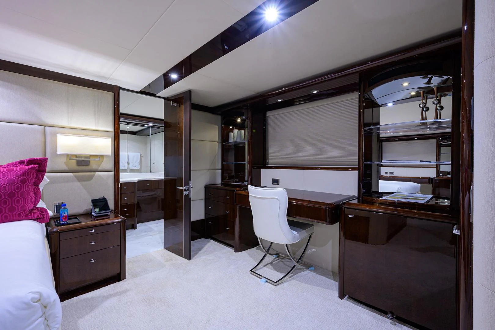 a room with a bed and a desk aboard PURE ROMANCE Yacht for Sale