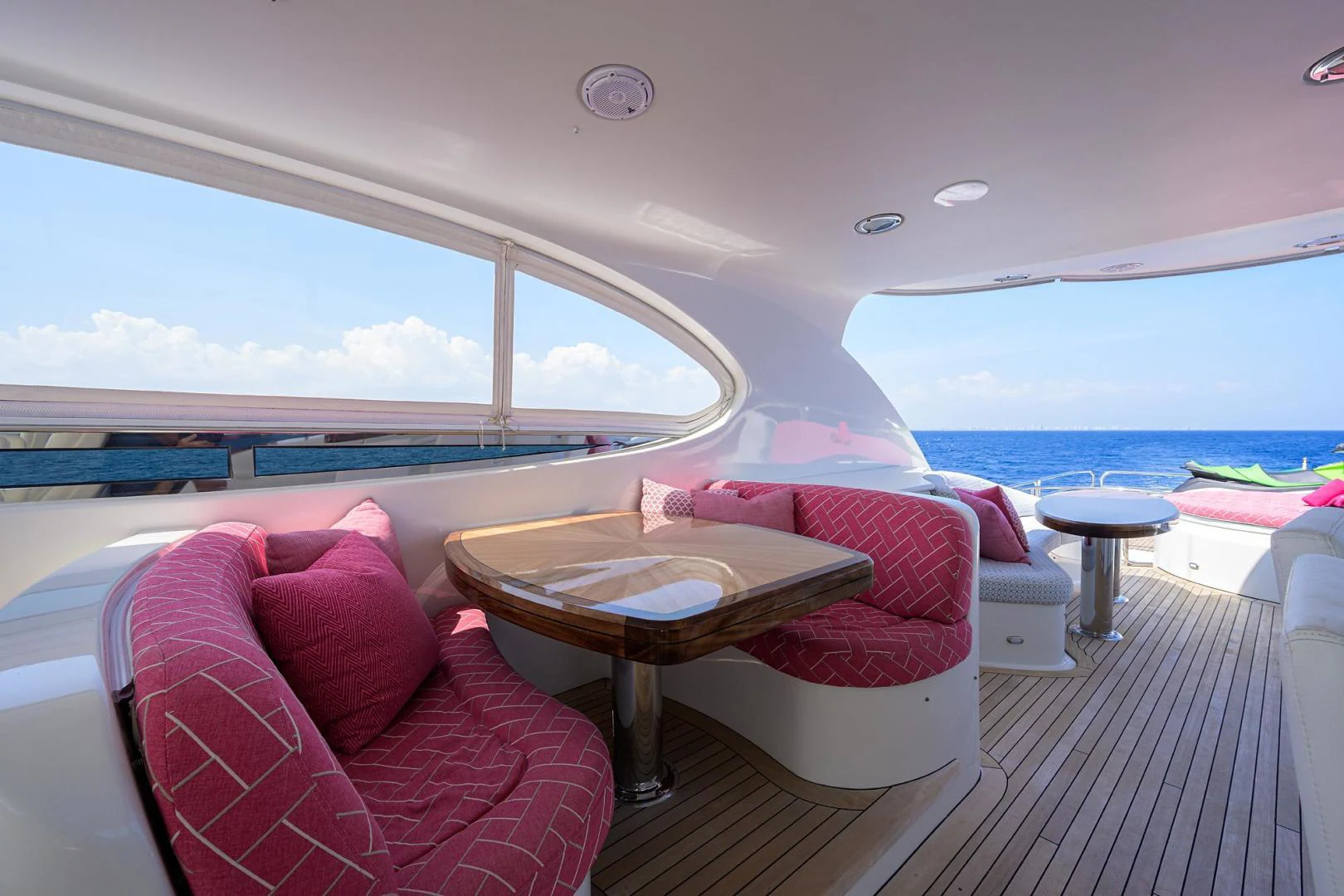 a room with a table and chairs aboard PURE ROMANCE Yacht for Sale