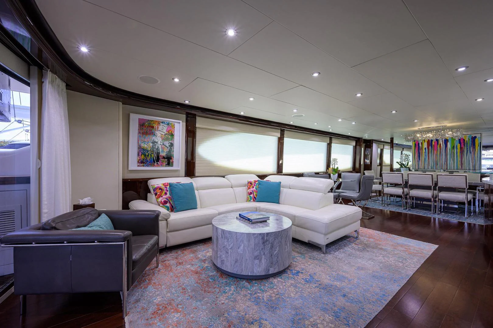 a living room with a couch and a table aboard PURE ROMANCE Yacht for Sale