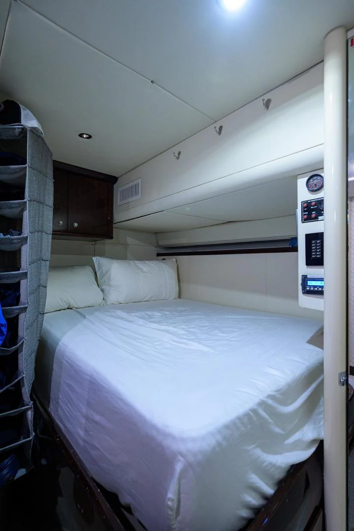 a bed with white sheets aboard PURE ROMANCE Yacht for Sale