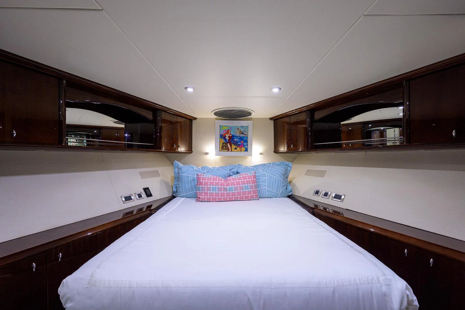 a bedroom with a bed and a television aboard PURE ROMANCE Yacht for Sale