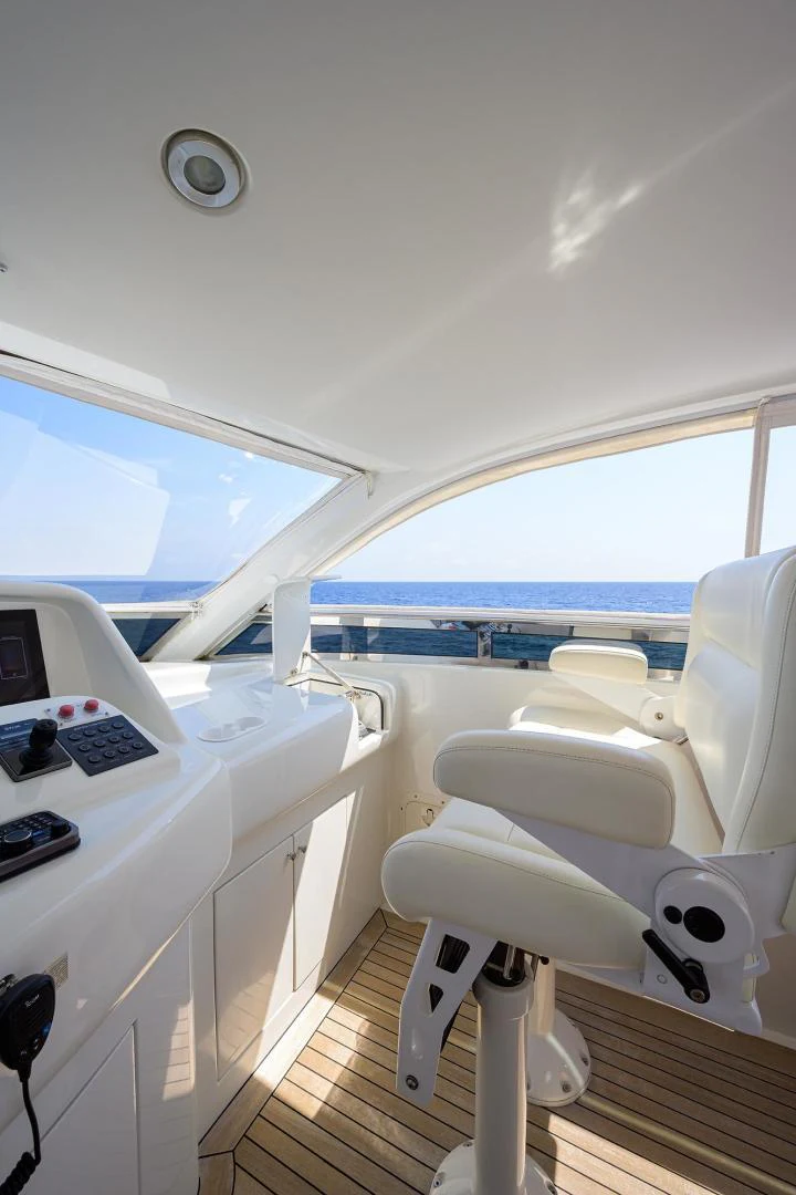 a white chair on a boat aboard PURE ROMANCE Yacht for Sale