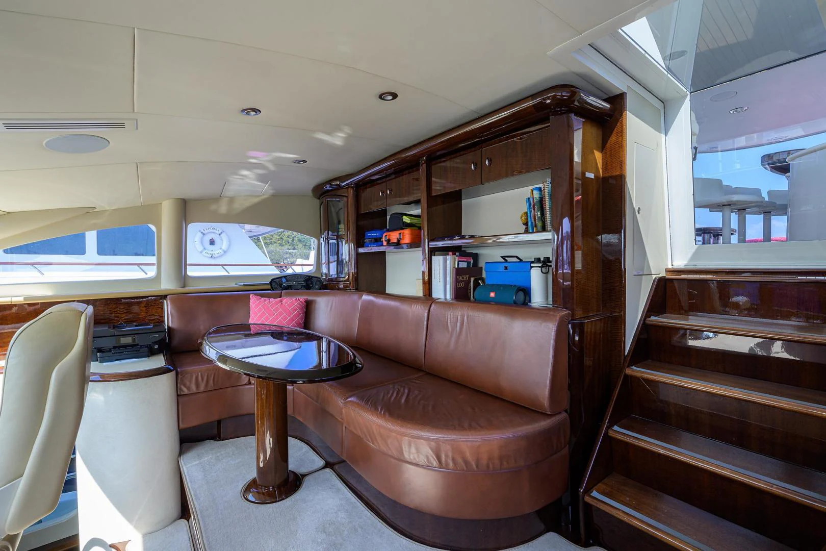 a brown leather couch in a room aboard PURE ROMANCE Yacht for Sale