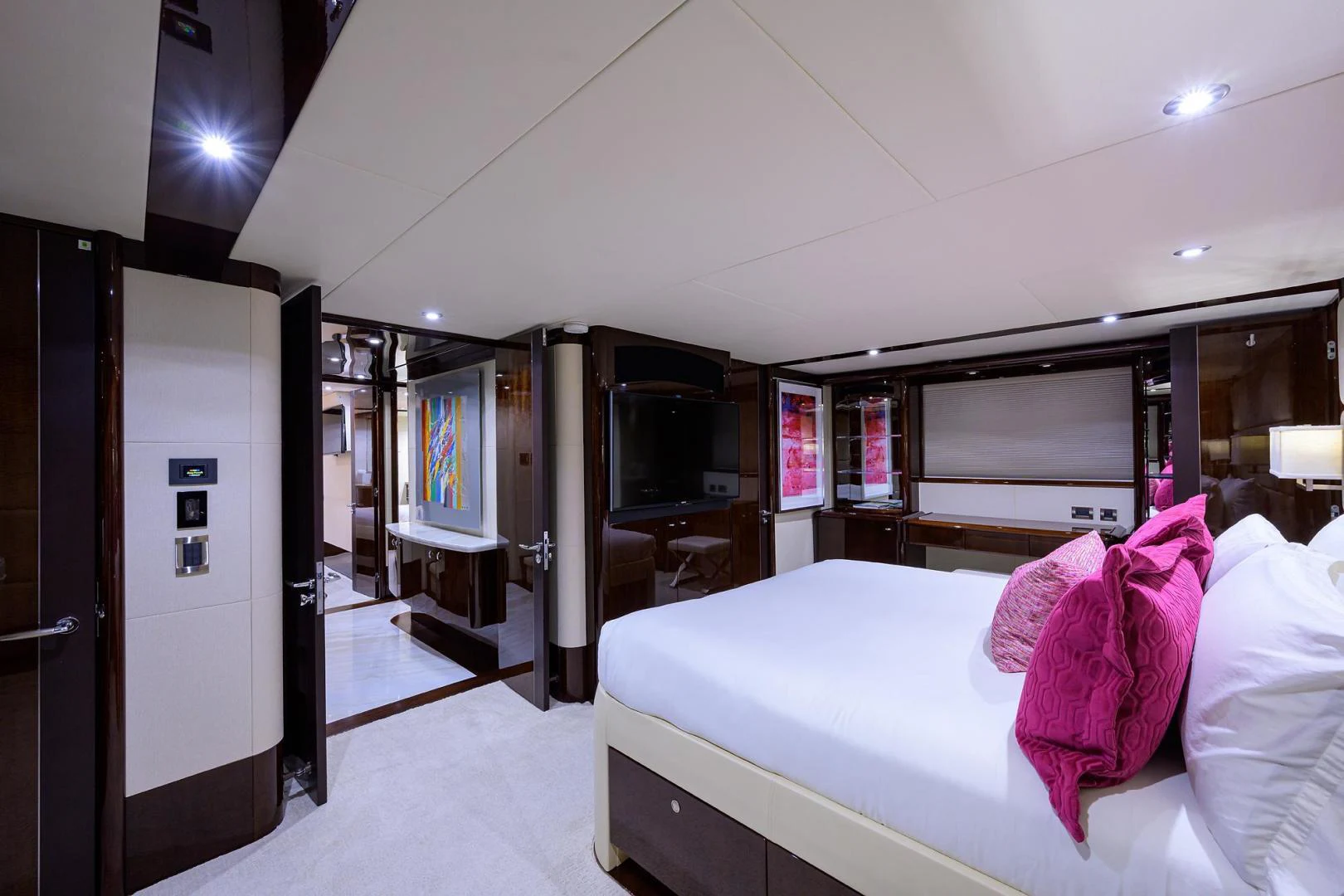 a room with a bed and a television aboard PURE ROMANCE Yacht for Sale