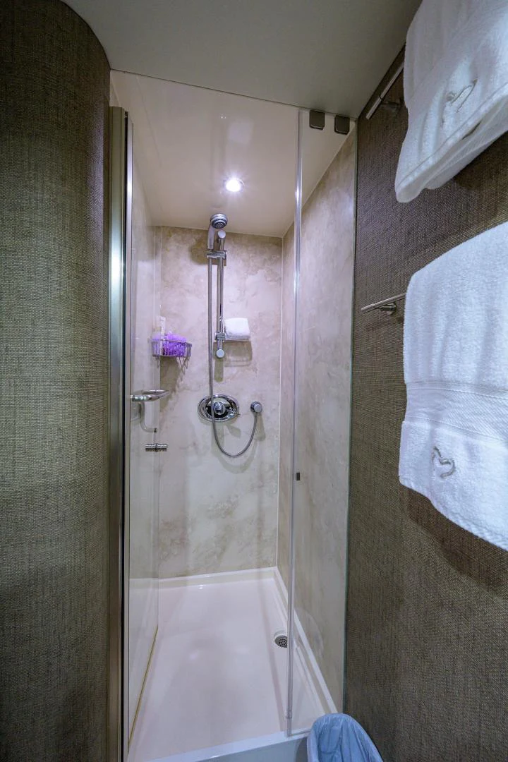 a shower with a glass door aboard PURE ROMANCE Yacht for Sale