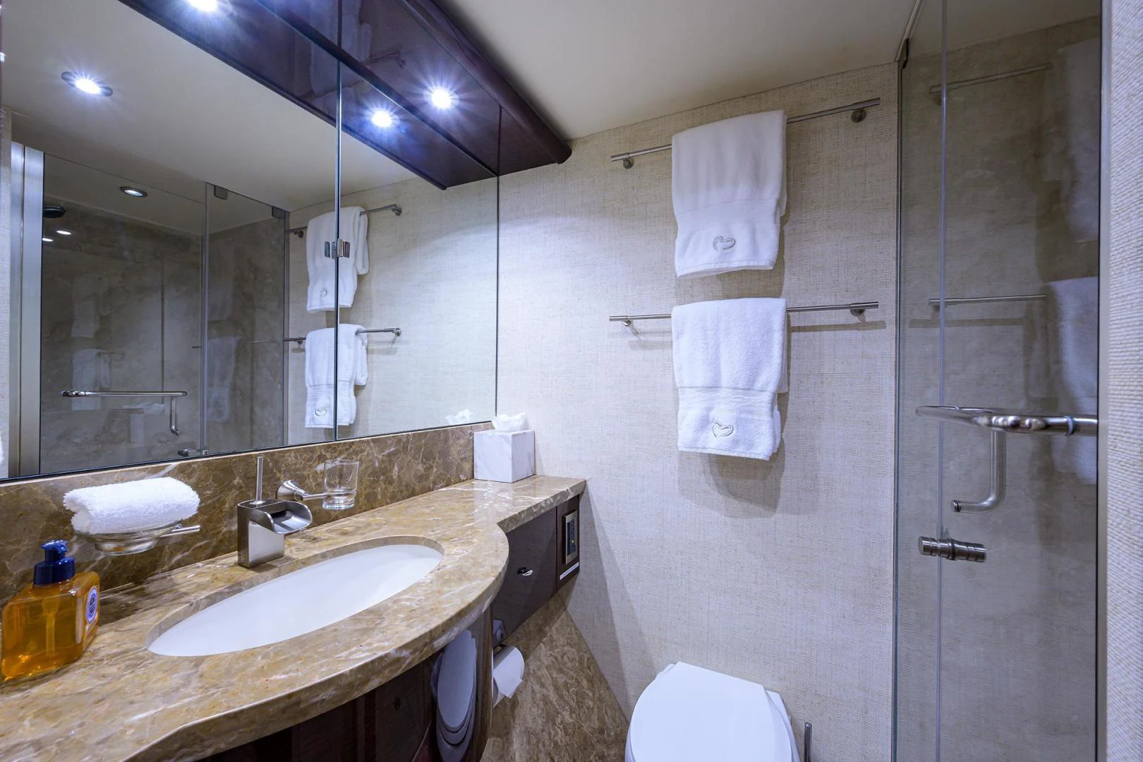 a bathroom with a sink and a mirror aboard PURE ROMANCE Yacht for Sale