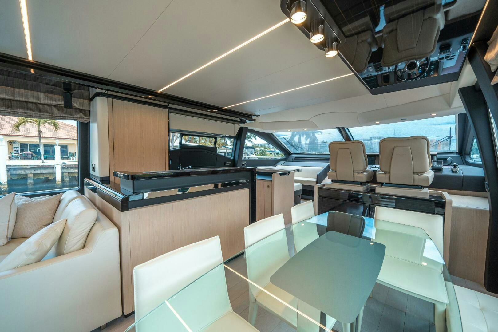 a room with a table and chairs aboard VELOCITY Yacht for Sale