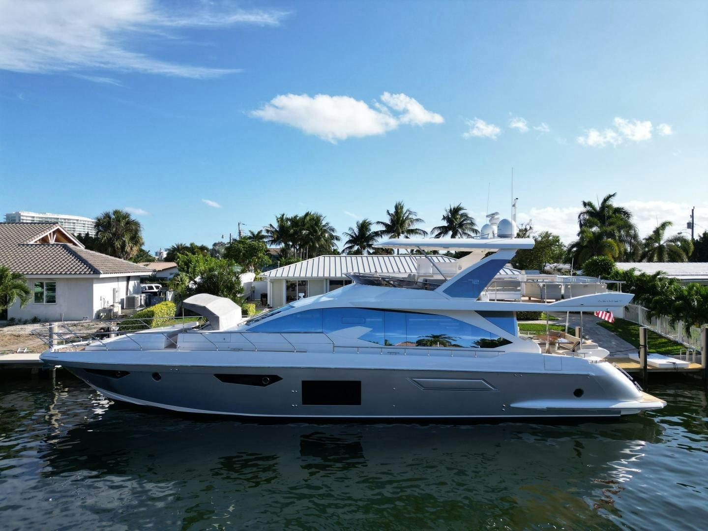 a white boat in a body of water aboard VELOCITY Yacht for Sale