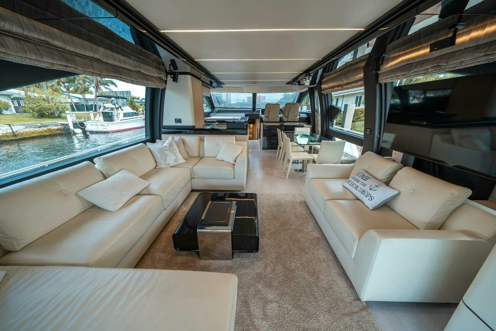 a living room with a couch and a table aboard VELOCITY Yacht for Sale