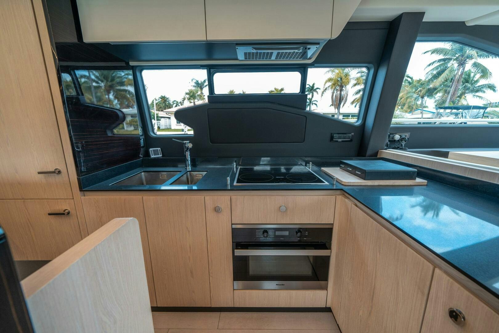 a kitchen with a stove and a sink aboard VELOCITY Yacht for Sale
