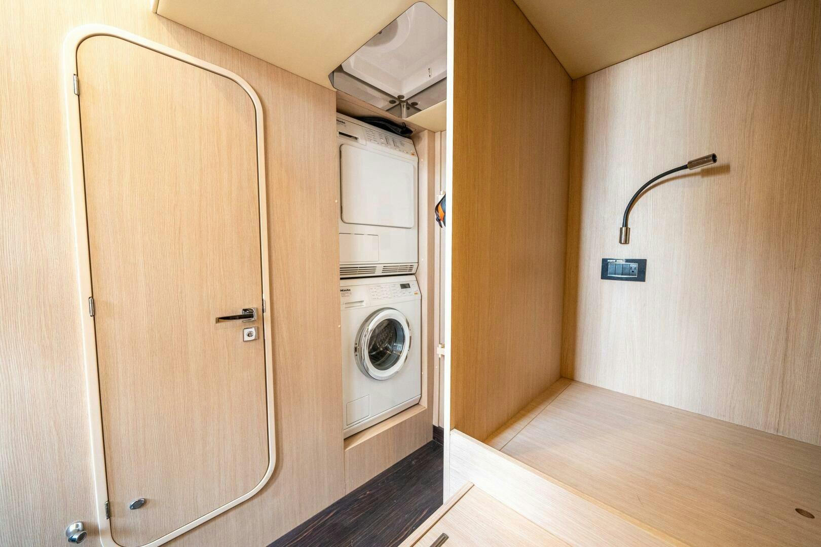 a room with a washer and dryer aboard VELOCITY Yacht for Sale