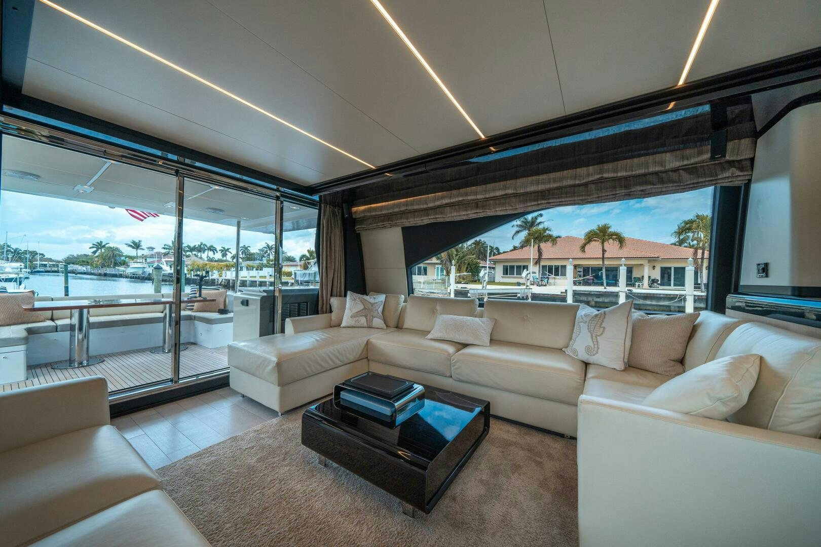 a living room with a large window aboard VELOCITY Yacht for Sale