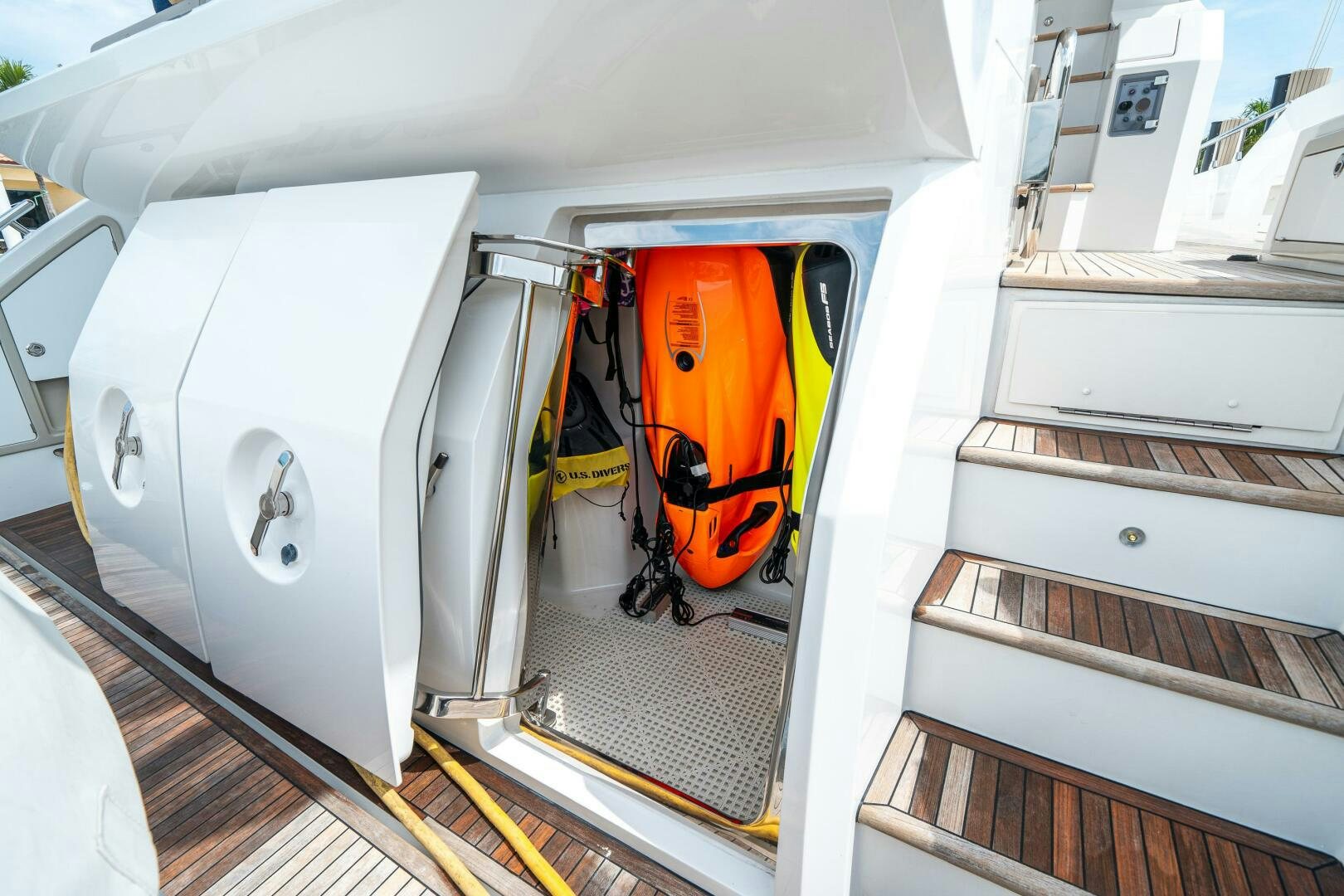 a white vehicle with doors open aboard VELOCITY Yacht for Sale