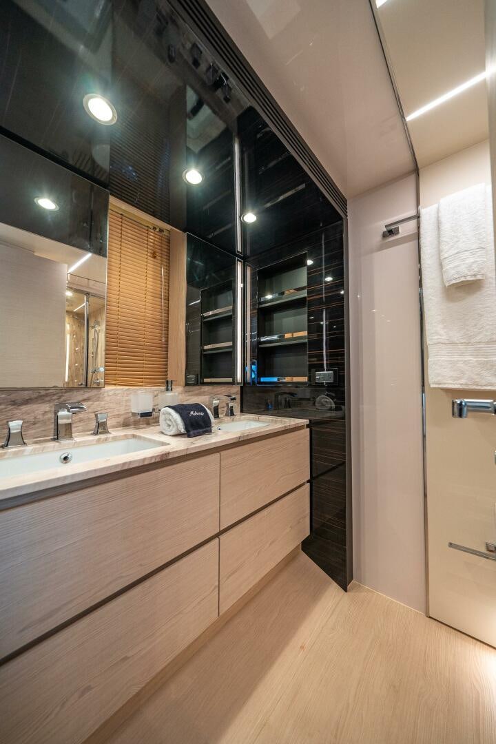 a bathroom with a sink and cabinets aboard VELOCITY Yacht for Sale