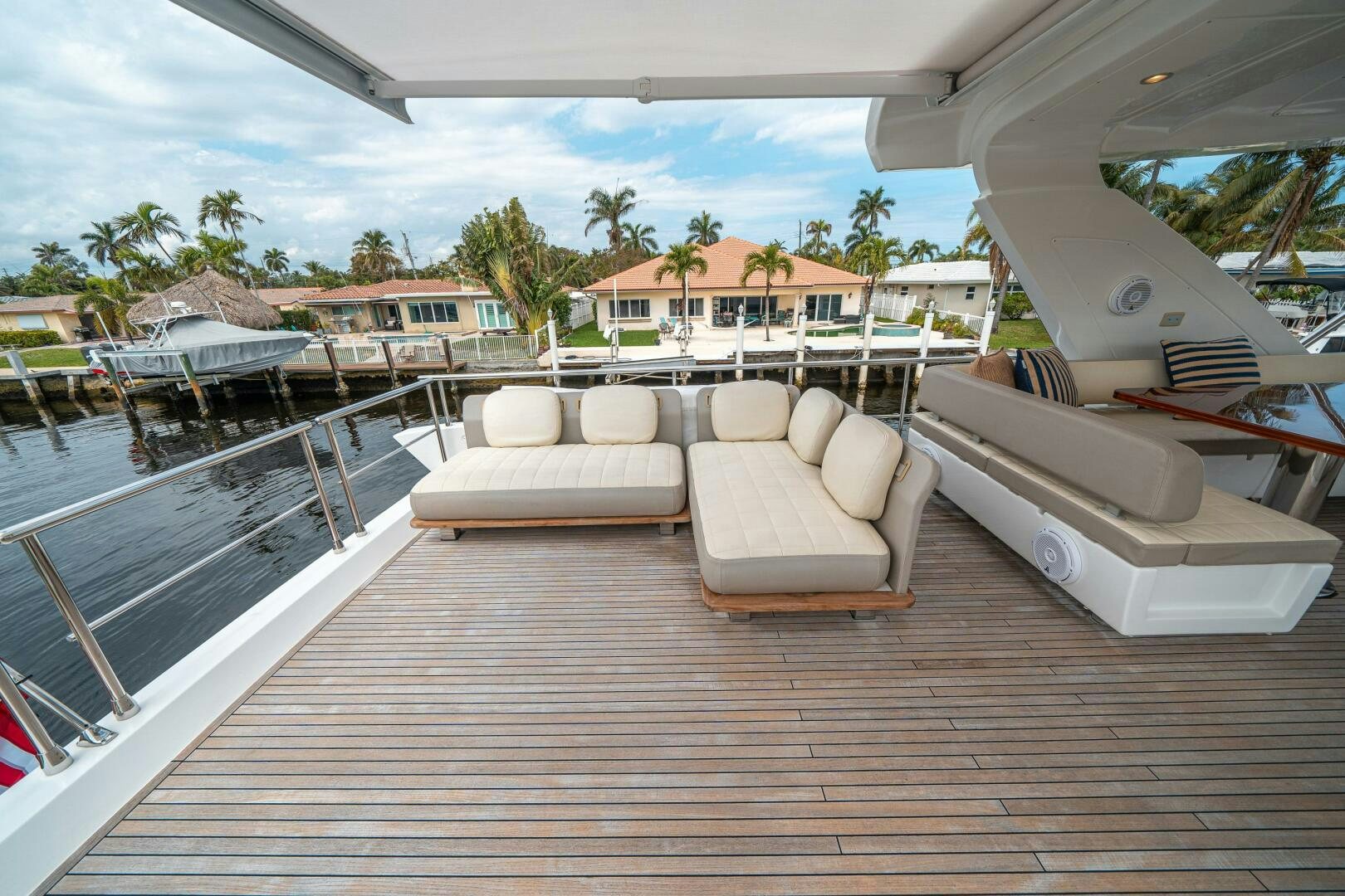 a deck with chairs and a pool aboard VELOCITY Yacht for Sale