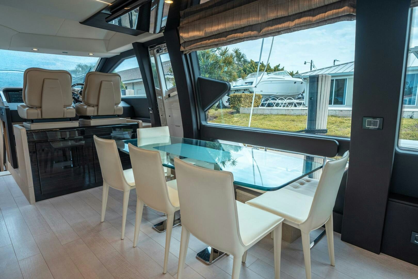 a table and chairs in a room aboard VELOCITY Yacht for Sale